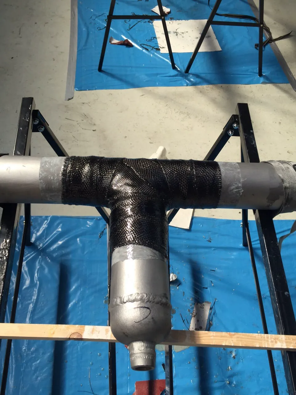 Carbon-fiber composite repair on a pipe tee