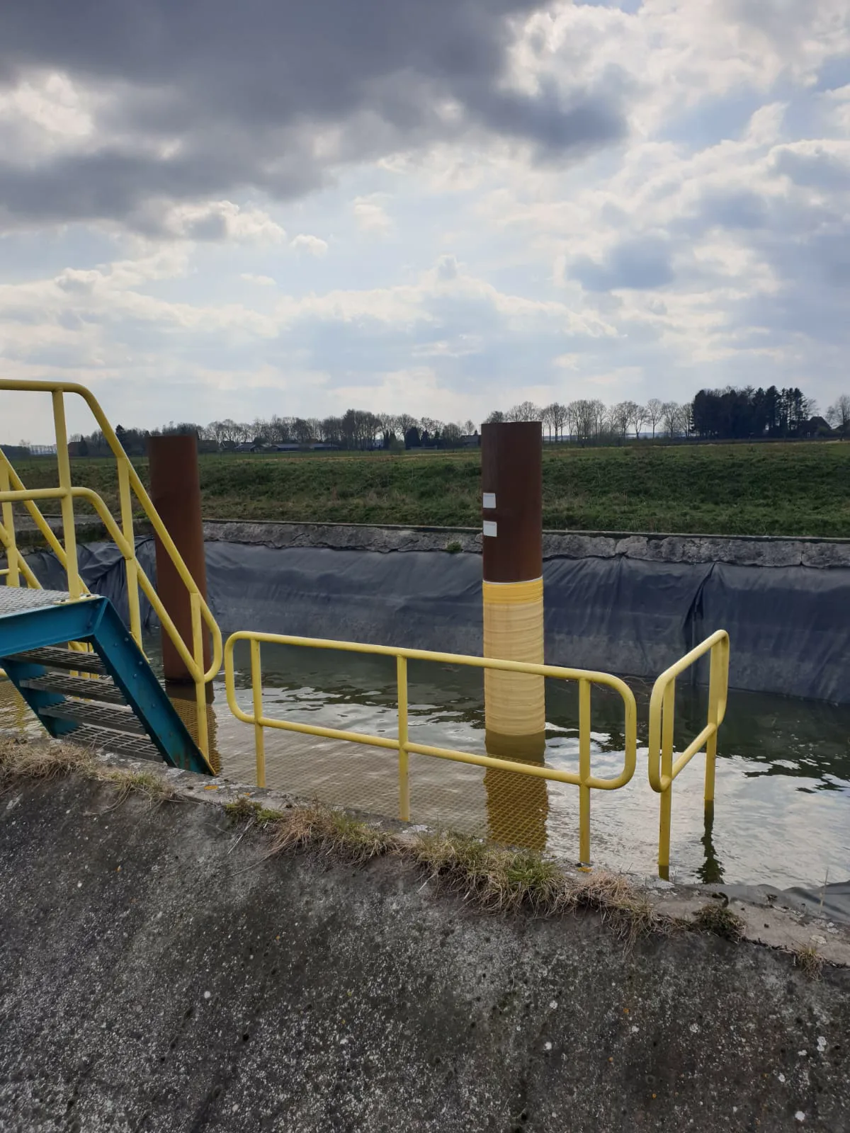Coated column at a water-treatment basin